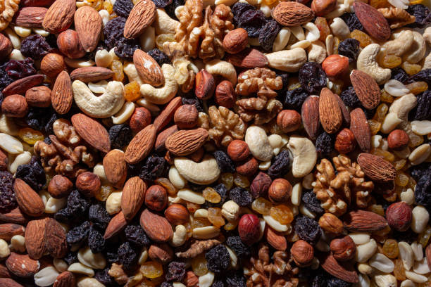 istock Mixed Nuts: Almonds, Walnuts, Cashews, Peanuts, Hazelnuts, Dried Prunes and Raisins 1911208317
