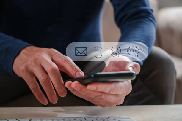 istock Contact us or Customer support hotline people connect. Businessman using a laptop and touching on virtual screen contact icons ( email, address, live chat, internet wifi ). 1911229198