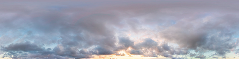 Rainbow Mountain Sunset Landscape Scenic View - Open meadow with colorful vibrant rainbow in sky with distant mountain views under dramatic sunset light.