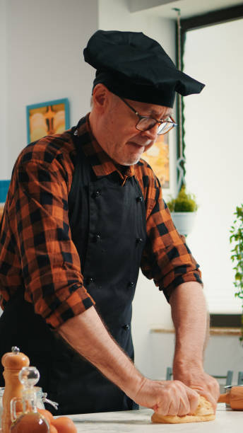 istock Confectioner working at home with the raw dough 1911266520