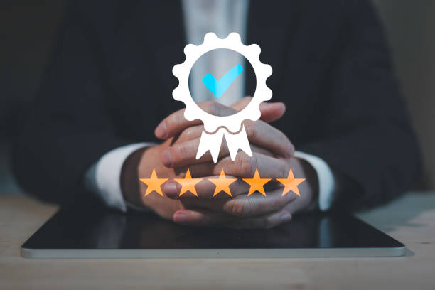 istock customer service evaluation and feedback rating. costumer review concept, man using phone chooses five star. 1911280160