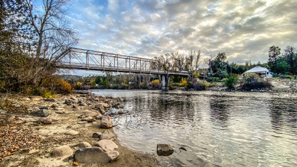 A stunning scene plays out  over the American River. This bridge has connected the two sides of the American River for almost 100 years. This area is famous for being the starting point of the California Gold Rush of 1848.