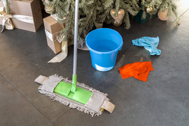 istock cleaning tiled floor after Christmas party 1911371076