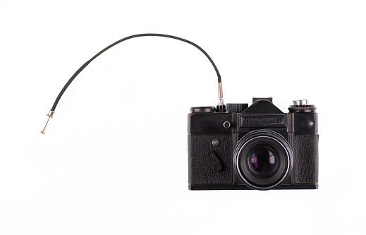 vintage film retro camera with cable isolated on white background