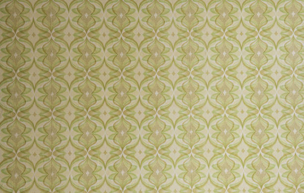 istock Old wallpaper on the wall. Old wallpaper for texture or background. 1911384721