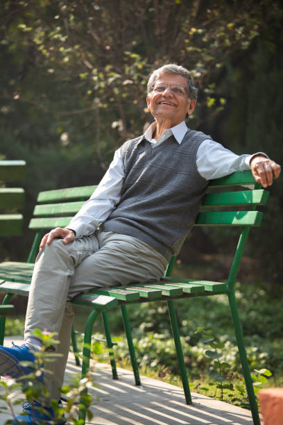 istock Thoughtful elderly man sitting on park bench 1911396888