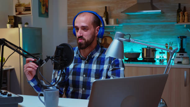 istock Man speaking during his online show 1911402249