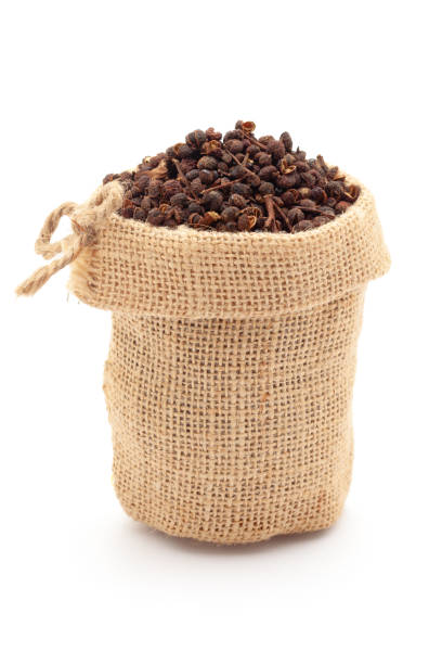 istock Dry organic Tomar Seeds (Zanthoxylum armatum) in a jute bag. 1911417104