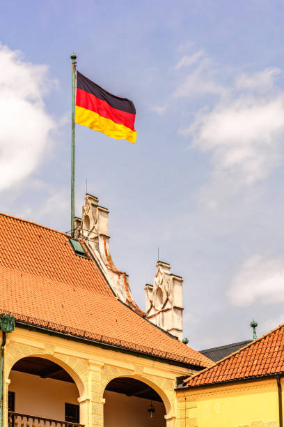 istock Germany flag flies on roof 1911426560