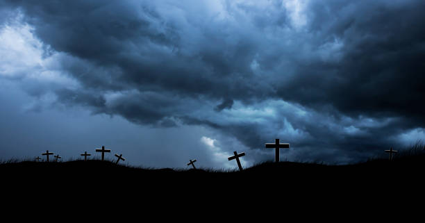istock 3D Rendering Silhouette Christian crosses grave on rain clouds background 1911497689