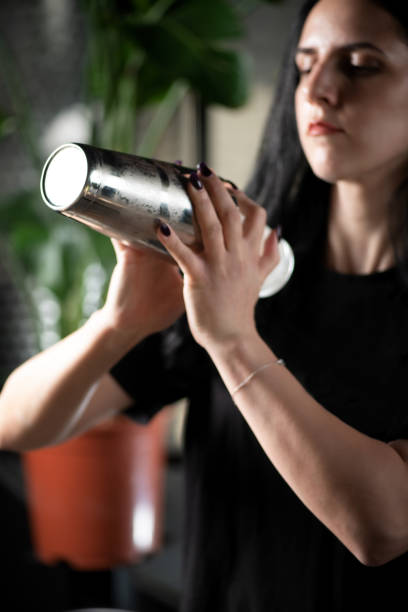 istock Barista Shakes up Ice Cubes with Milk, Preparing Iced Coffee 1911501921