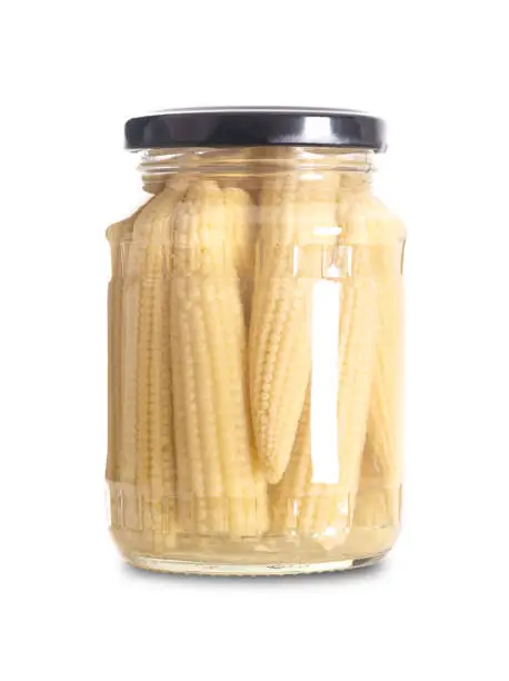 Photo of Baby corn, pickled young corn, cornlettes or baby sweetcorn, in glass jar
