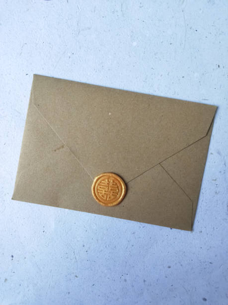 istock Envelope with wax seal on a white background, top view 1911513633