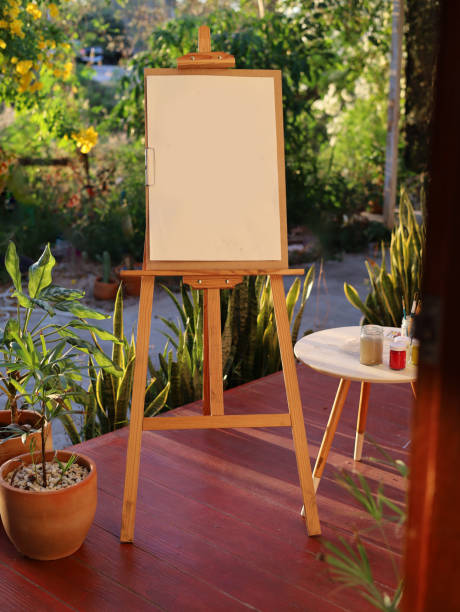 istock Easel with blank paper and drawing tools on the balcony home. 1911515219