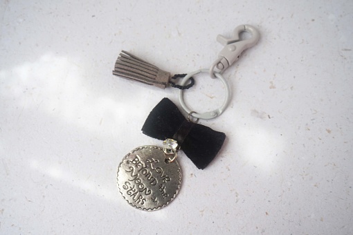 old vintage pocket watch and key on a white background