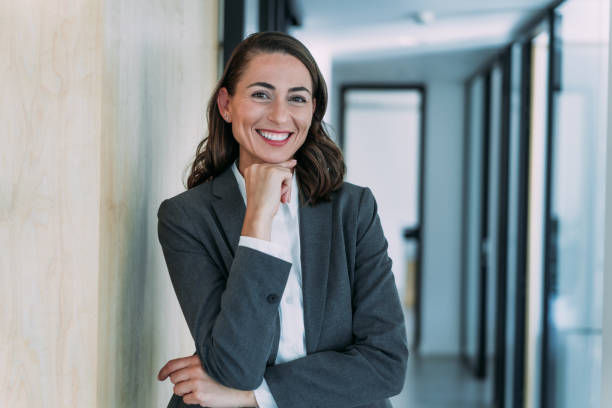 istock Confident businesswoman in modern office. 1911521655