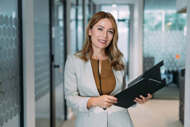 istock Confident businesswoman in modern office. 1911521711