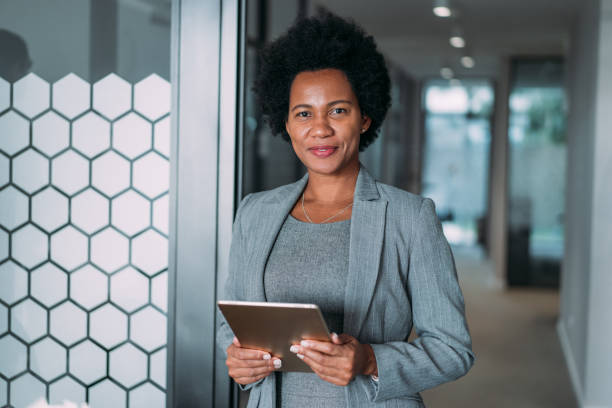 istock Confident businesswoman in modern office. 1911521717