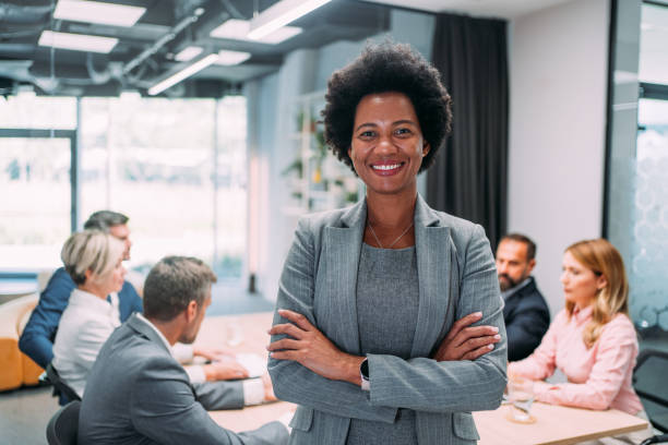 istock Confident businesswoman and her team. 1911521749