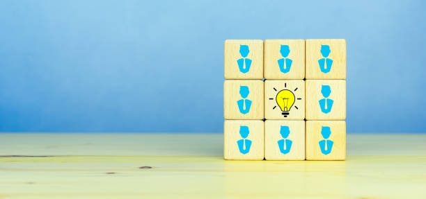istock Brainstorming, Creative, New idea, innovation and solution concept. Wooden cubes with the yellow light bulb and businessman icons symbol with copy space 1911524515