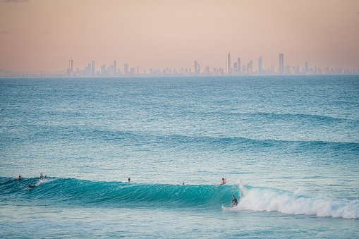 wave at Coolangatta with city skyline in background