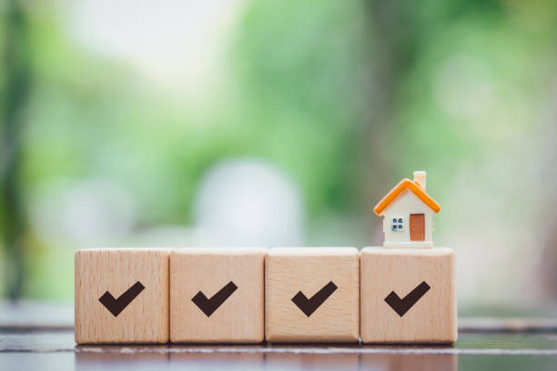 istock Home buying checklist and complete check mark with house model. 1911545973