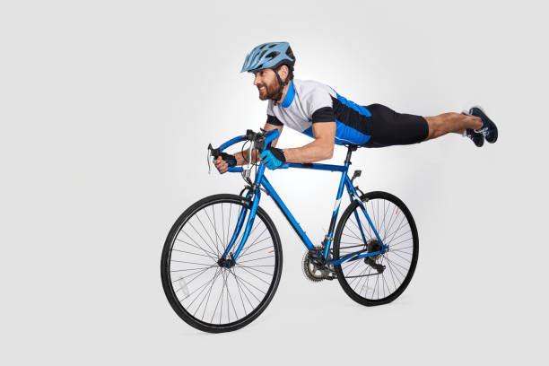 istock Strong bearded cyclist doing trick on bike during ride. 1911549773