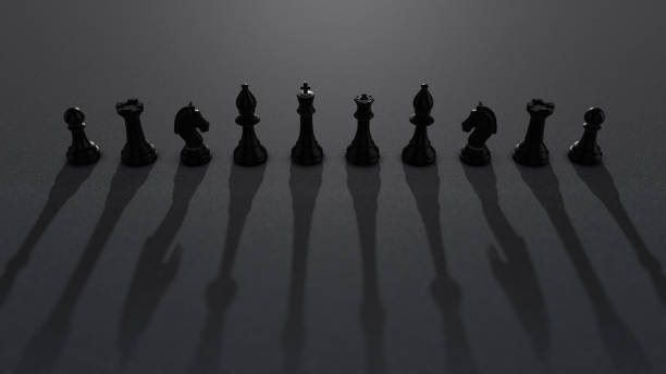 shot of black chess pieces with dramatic light moving and creating moving dramatic shadows - checking the time imagens e fotografias de stock