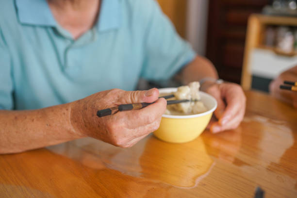istock one old man eat dumpling in the dining room 1911564712