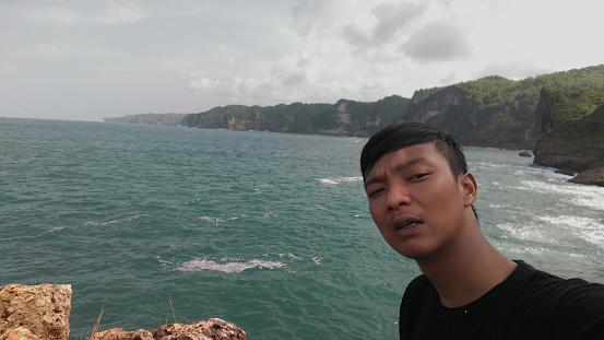 Selfie photos with views of the sea and cliffs