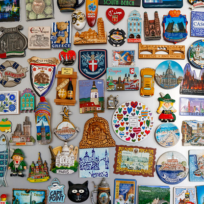 Limassol, Cyprus, December 12th, 2023: Multi colored magnets from around the world on home fridge door