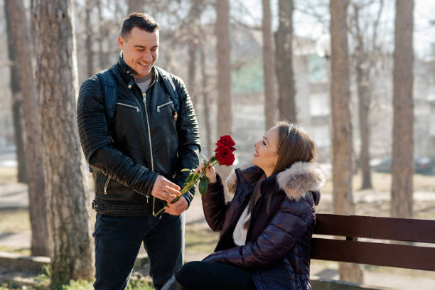 istock Man giving roses to his girlfriend on Valentine's day 1911588532