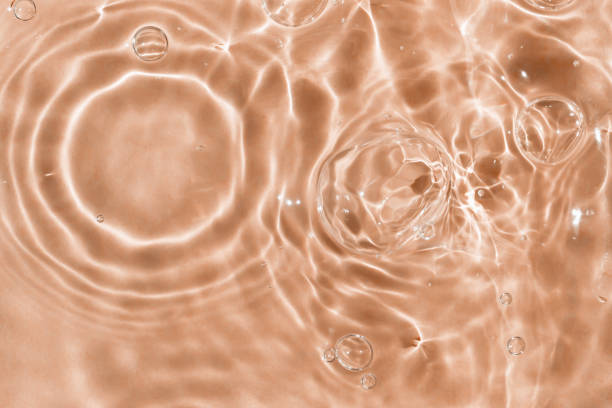 istock Sun glare, bubbles on the water 1911591168