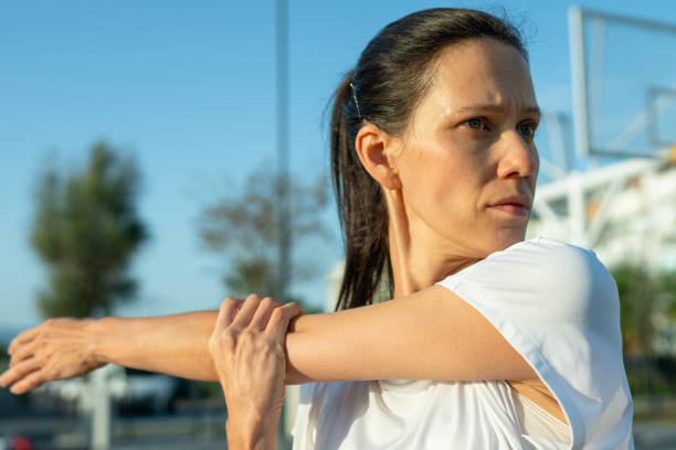 istock Female athlete stretching before morning run 1911601983