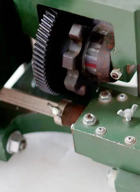 Close-up view of gears and parts of a machine In an industry