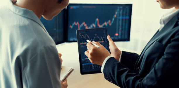 istock Professional stock broker show tablet displayed growth stock graph. Burgeoning. 1911618636