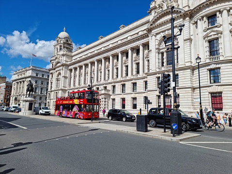 London historic district (next the buckingham palace) with some double decker Buses. The image was captured during summer season.