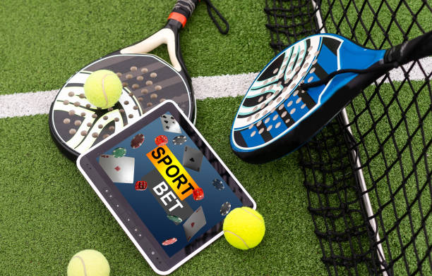 istock paddle rackets on the playing court 1911623306