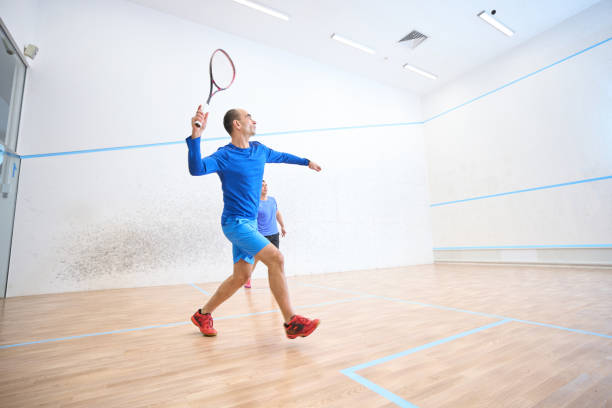 istock Active men enjoying playing squash displaying agility and love for competition 1911636972
