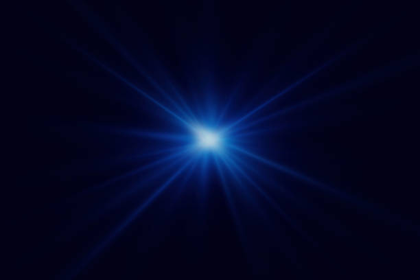 istock Blue glitter light effect. Light beam of explosion with glare of light. 1911648124