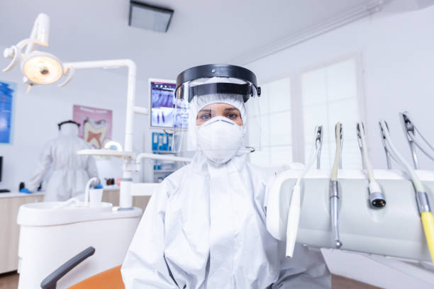 istock Patient pov of dentist explaining teeth treatment 1911665823