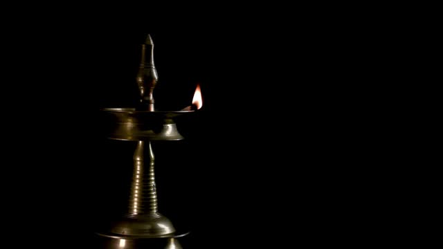 Indian oil lamp isolated in Black Background, 4k Video