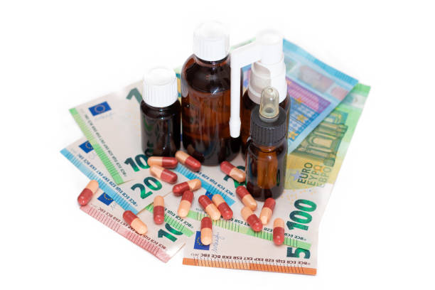 istock Different Bottles with Pills, Capsules and Medicines on the Euro Banknotes 1911669085