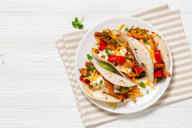istock baked tex-mex chicken fajitas on a plate, top view 1911670133