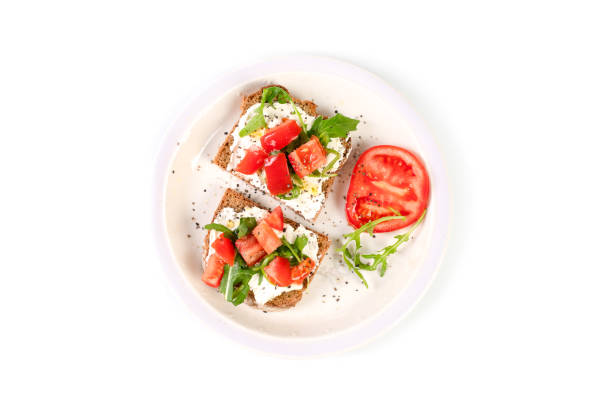 istock Sandwiches with soft cheese and herbs and tomatoes 1911697314