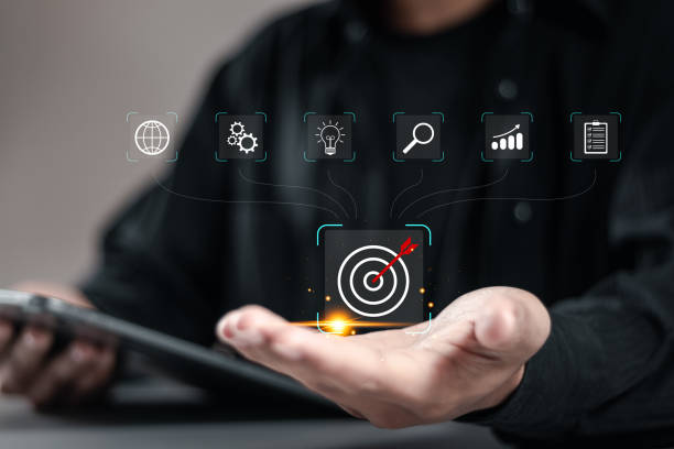 istock Target goal concept. Businessman holding target  icon and set up business objective target for marketing strategy planning and business growth. 1911714173