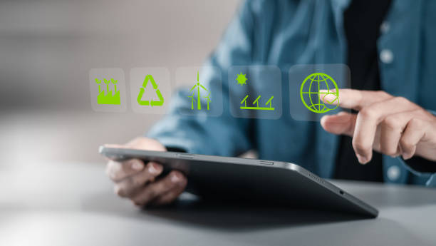 istock Businessman using tablet with reduce CO2 emissions carbon global symbol on green background for climate change to limit global warming and sustainable development and green business concept. 1911719958
