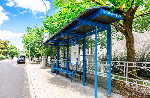 Munich, Germany - July 22, 2023: Empty bus stop in Munich on summer sunny day, Bavaria, Munich, Germany