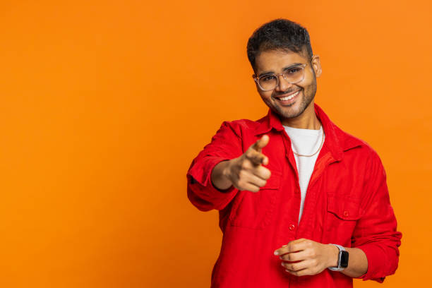 istock Happy Indian smiling man pointing finger to camera making winner choice, showing direction, select 1911738778