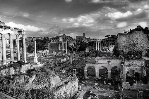 th Roman archaeological area called the Roman forum in black and white